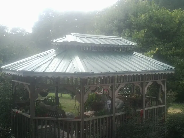 Two tier green metal roof on a garden gazebo in Glen Ridge
